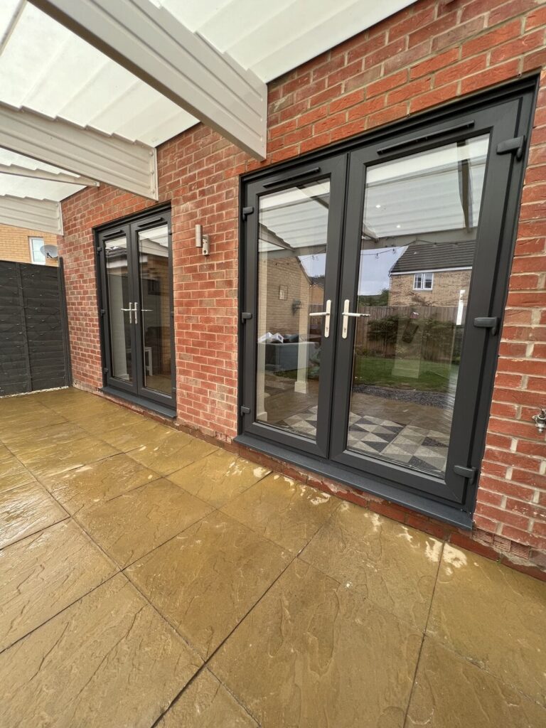 Modern patio doors on red brick house
