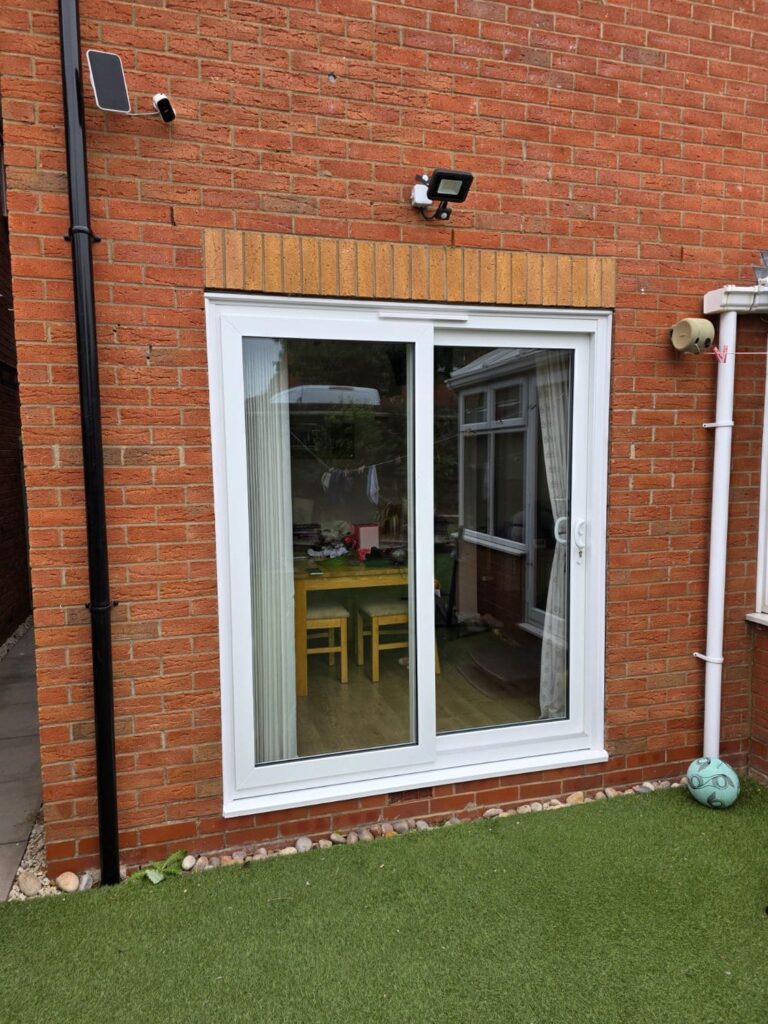White sliding patio door installed by Pioneer Doors & Windows